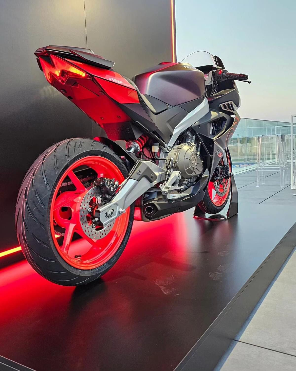 The third picture of a red bike